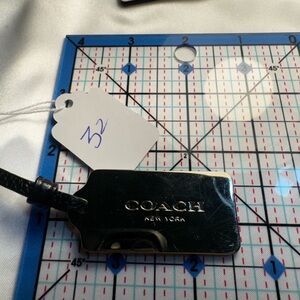 Coach Dark Leather Bag Tag